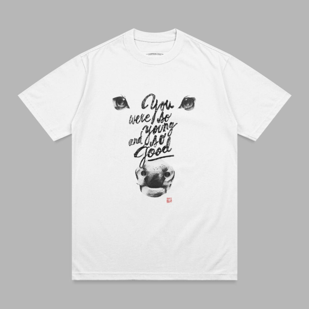 White t-shirt with black text and bull graphic.