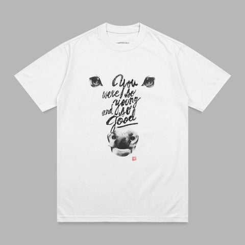 White t-shirt with black text and bull graphic.