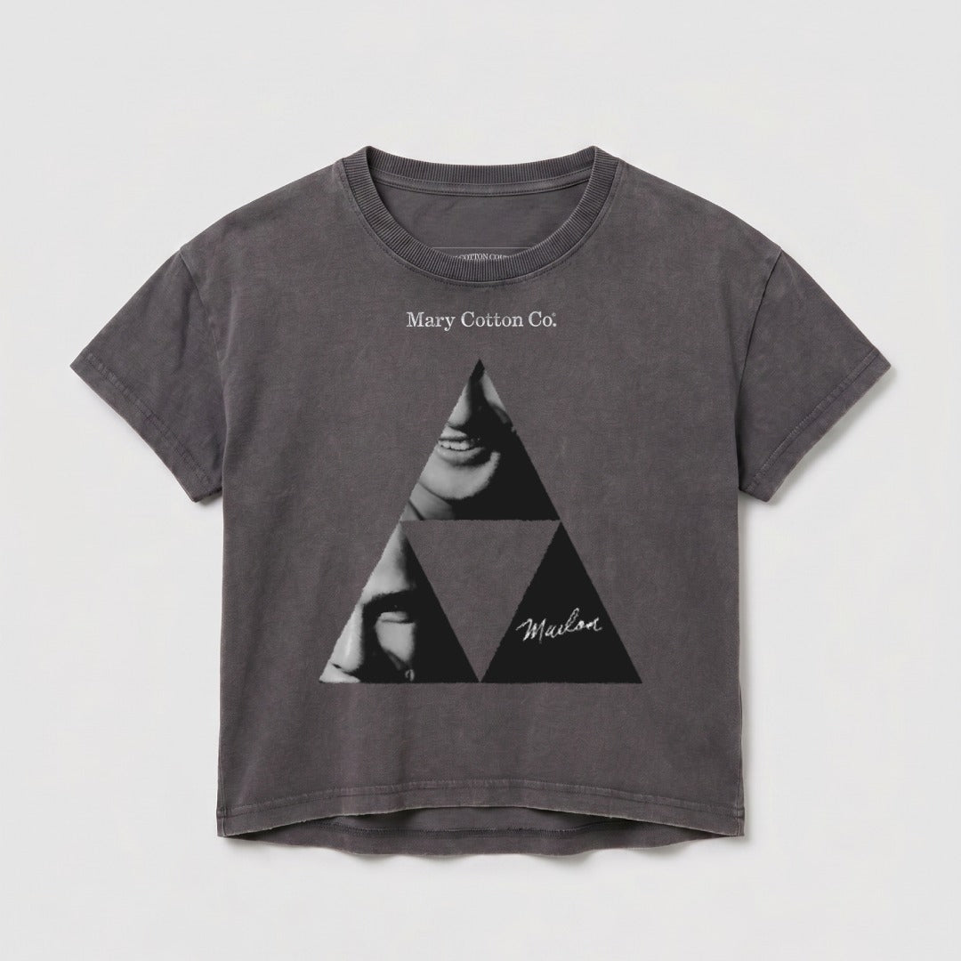 Dark grey crop t-shirt with a triangle graphic featuring faces and "Malibu" text.