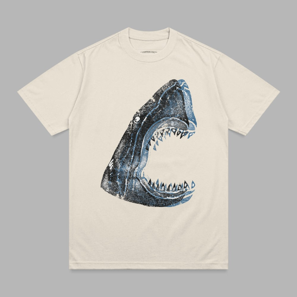 T-shirt with a dark blue shark head graphic with open jaws.