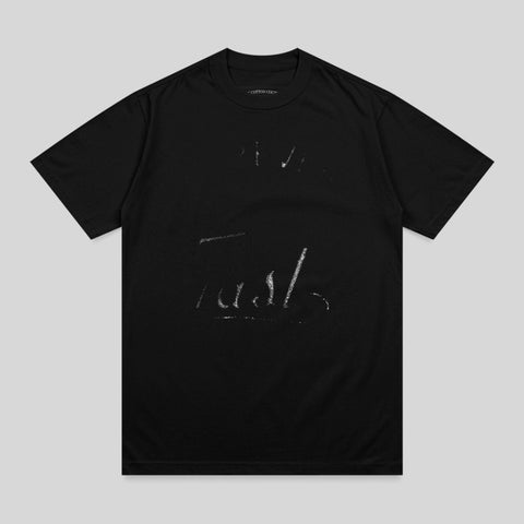 Black t-shirt with white text that reads "Trust" across the chest.
