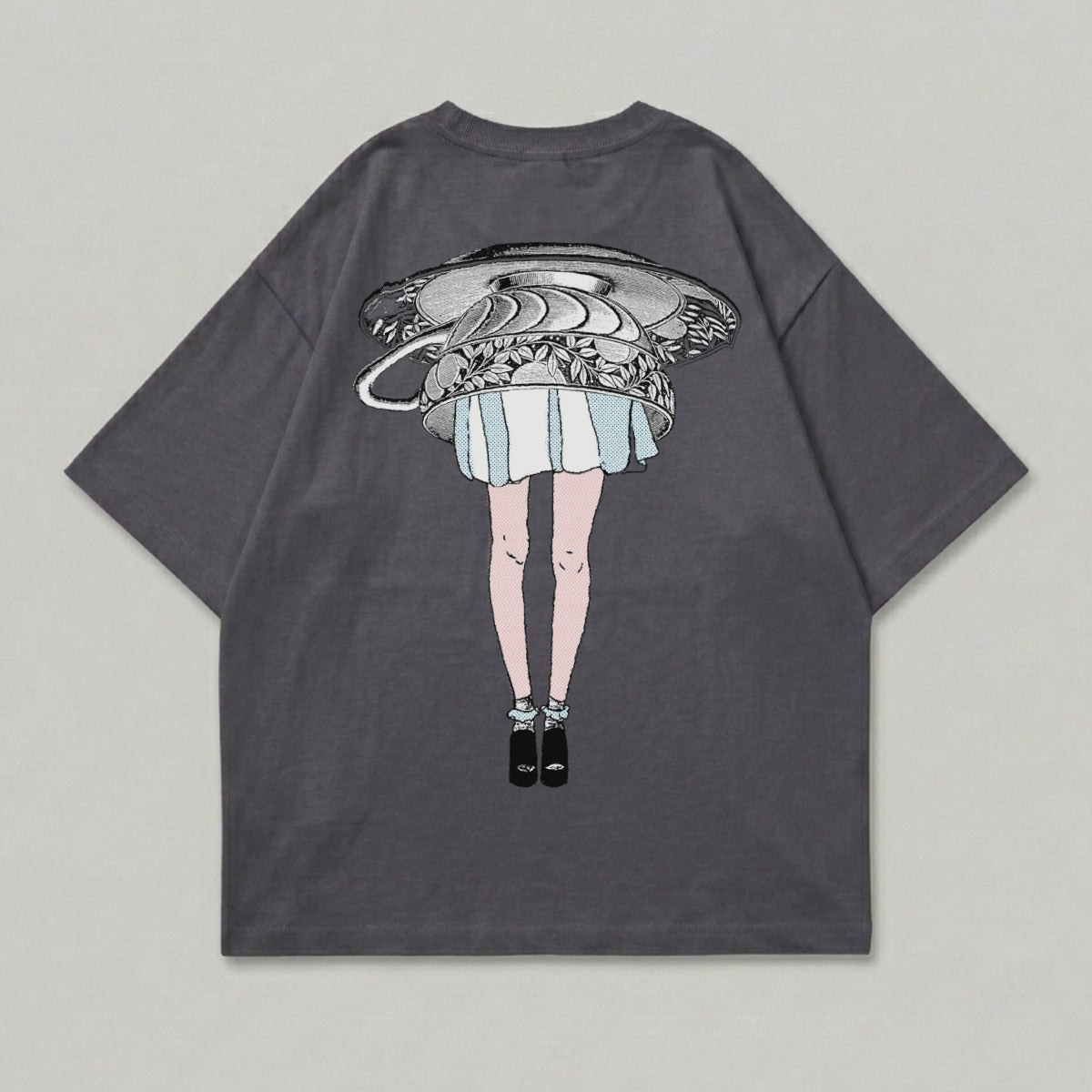 Graphic t-shirt with illustration of a woman's legs below a teacup.