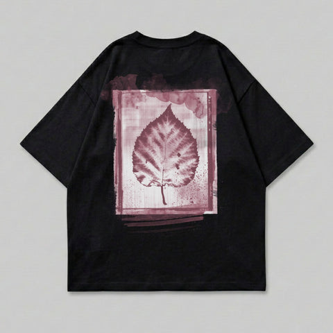 Black t-shirt with a large, red leaf print on the back.