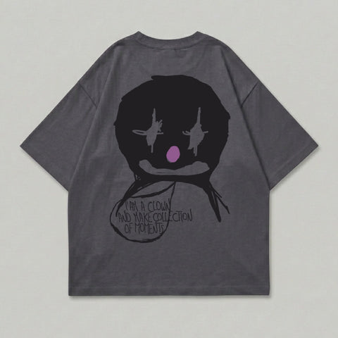 Dark grey t-shirt with a black clown face graphic and text.
