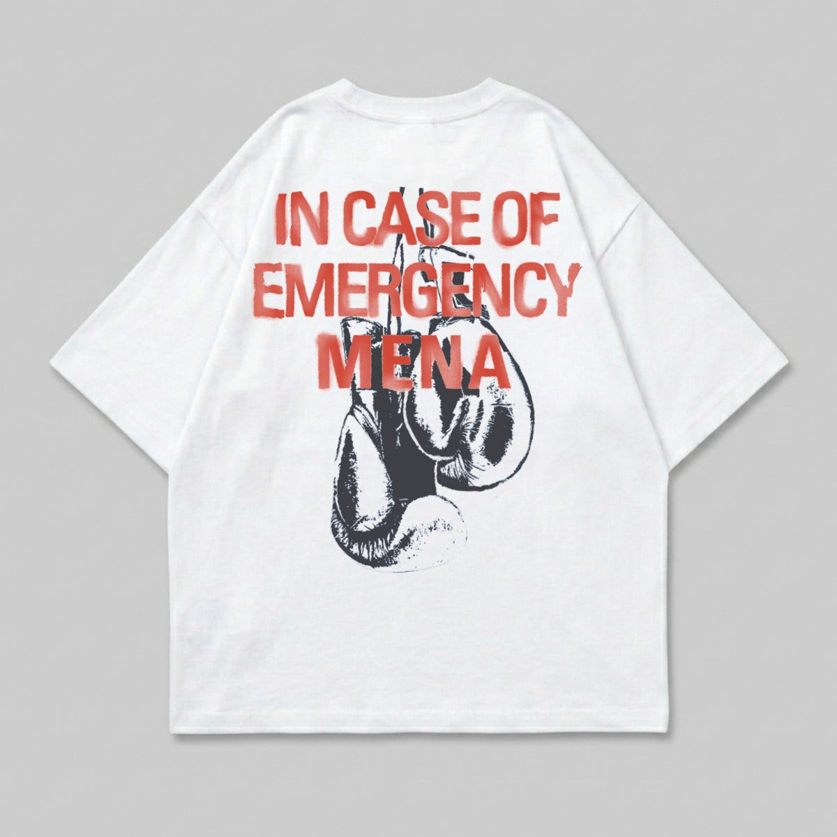White t-shirt with red text "IN CASE OF EMERGENCY" above boxing gloves.