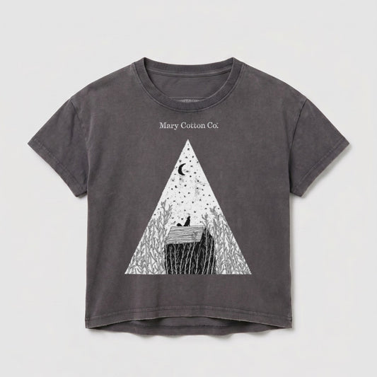 Grey t-shirt with a triangular design featuring a moon, stars, and a house.
