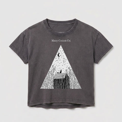 Grey t-shirt with a triangular design featuring a moon, stars, and a house.