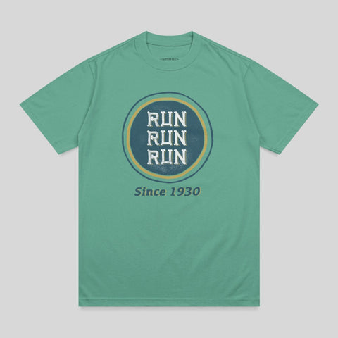 Green t-shirt with circular "RUN RUN RUN" logo and "Since 1930" text.