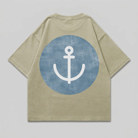 Tan t-shirt with a blue circle containing a white anchor graphic on the back.