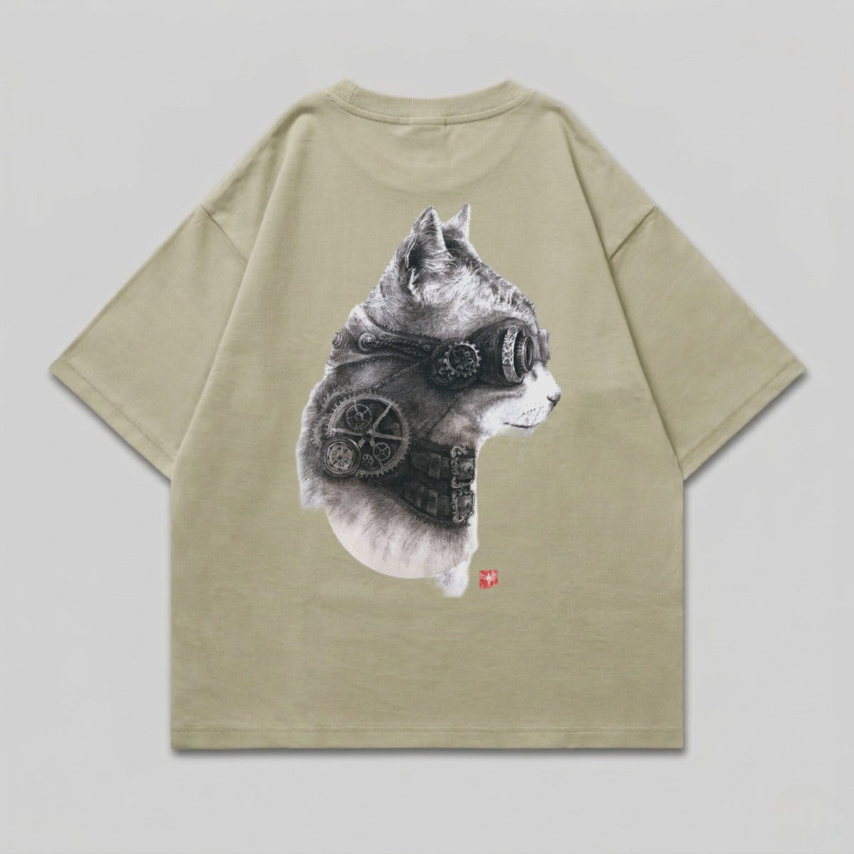 Steampunk cat head graphic on khaki t-shirt.