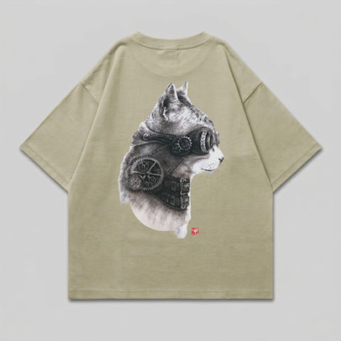 Steampunk cat head graphic on khaki t-shirt.