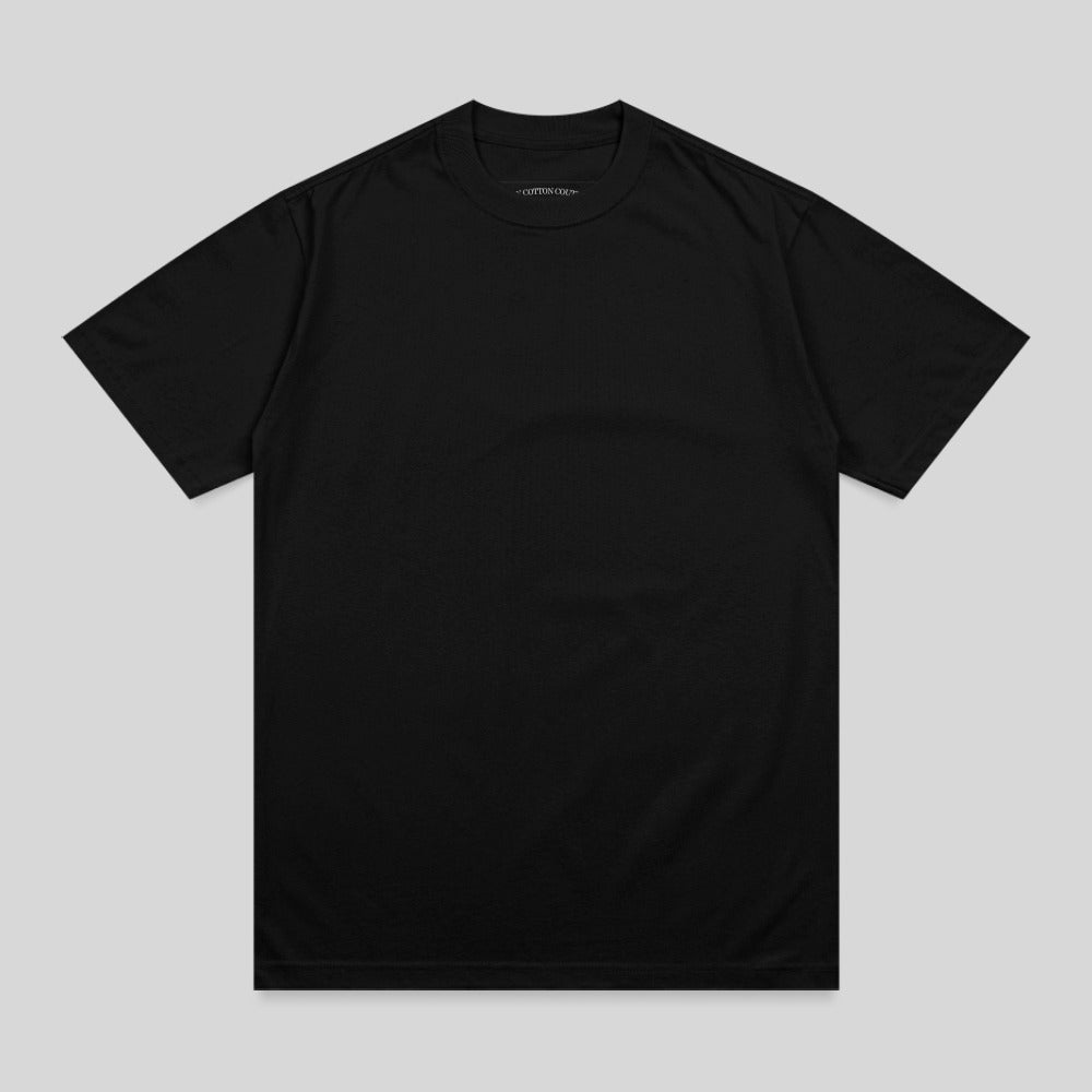 Black crewneck t-shirt with "The Cotton Crew" printed on the inside neck tag.