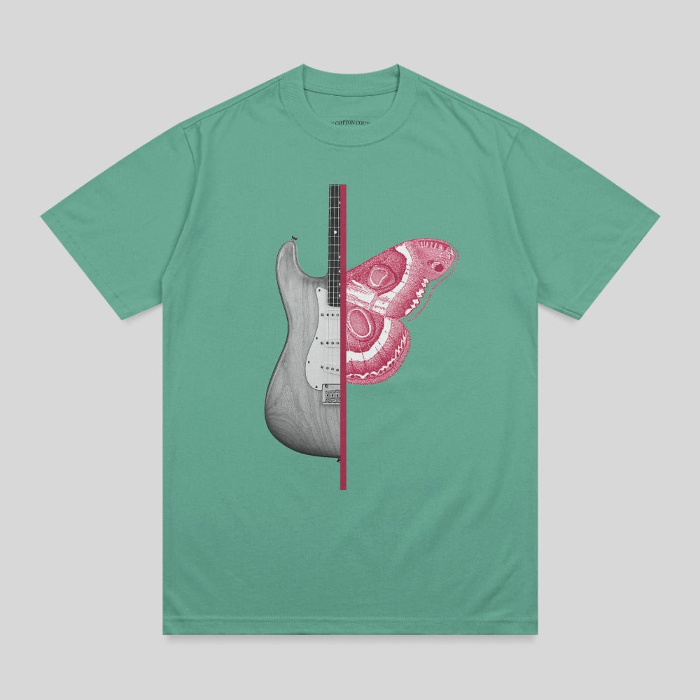 T-shirt with a graphic of a guitar split with a pink moth design.