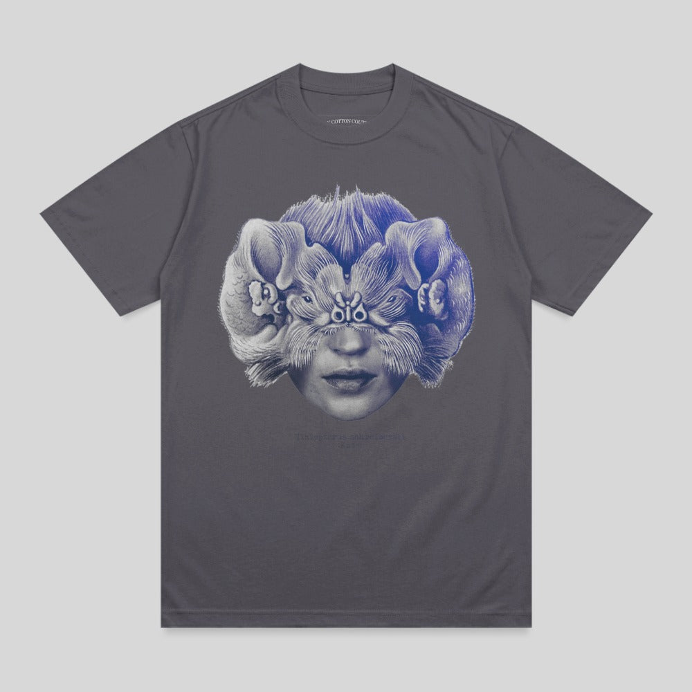 Gray t-shirt with surreal face and animal illustration, "THE TERROR IS WHAT'S INSIDE" text.