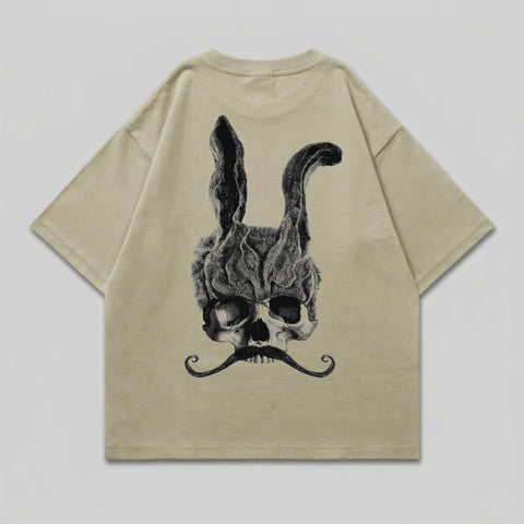 T-shirt with skull, rabbit ears, and mustache graphic.