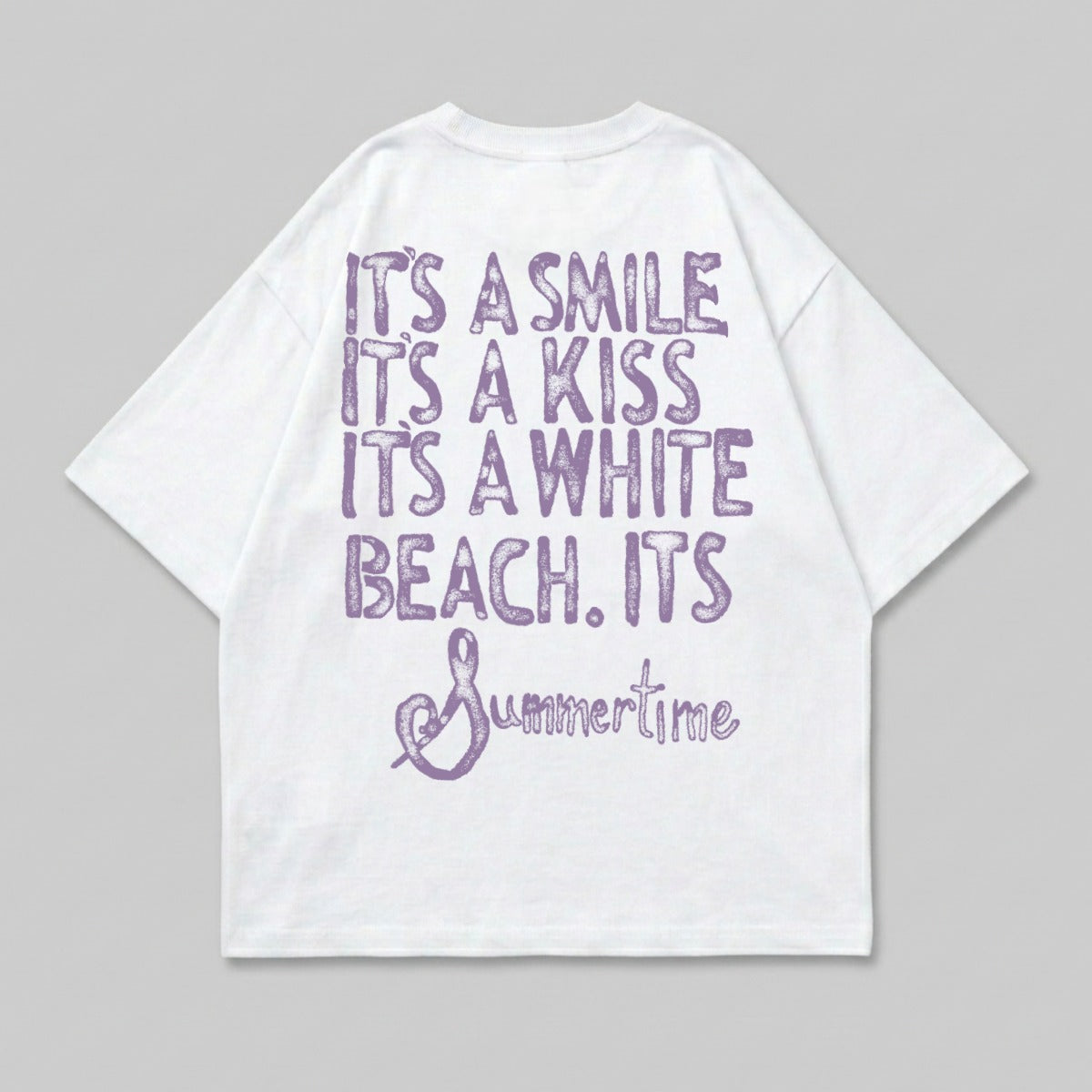 White t-shirt with purple text reading "It's a smile. It's a kiss. It's a white beach. It's Summertime."