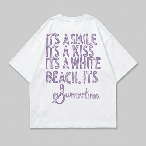 White t-shirt with purple text reading "It's a smile. It's a kiss. It's a white beach. It's Summertime."