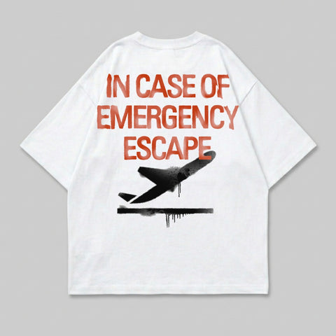 White t-shirt with red text "IN CASE OF EMERGENCY ESCAPE" and a black airplane graphic.