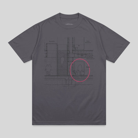 Blueprint schematic of a building interior with a pink circle highlighting a toilet stall.