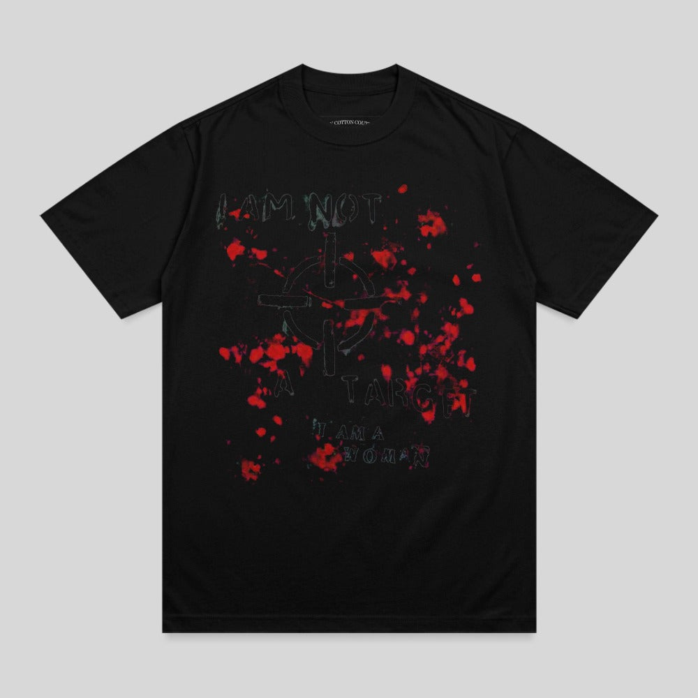 Black t-shirt with red paint splatters and "I AM NOT A TARGET I AM A WOMAN" text.