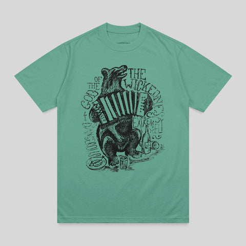Bear playing accordion with "The Wicked Snow" text.