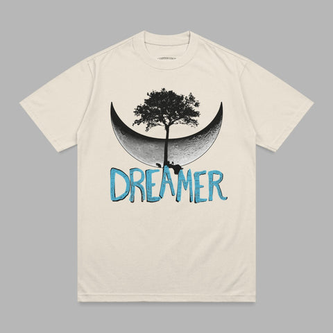 Cream t-shirt with crescent moon, tree, and "DREAMER" text graphic.