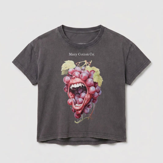 Dark grey t-shirt with graphic of a mouth biting a bunch of grapes.