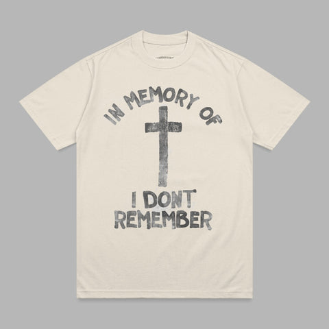 Cream t-shirt with black graphic of a cross and text "IN MEMORY OF I DON'T REMEMBER".