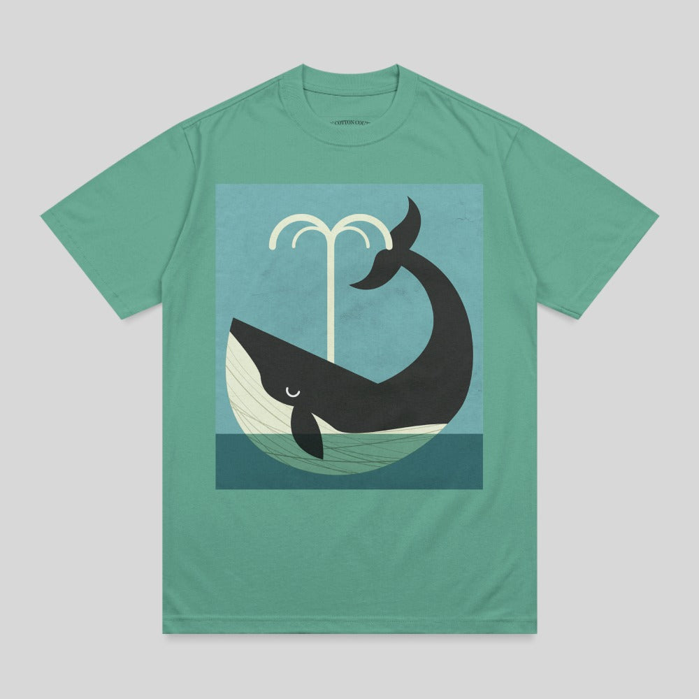 Green t-shirt featuring a stylized whale spouting water against a blue background.