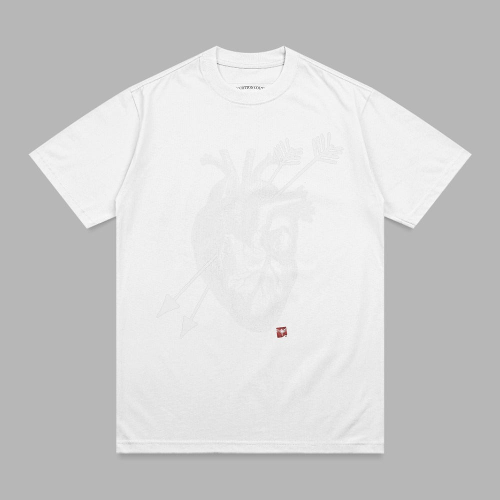 White t-shirt with a white anatomical heart and crossed arrows graphic.