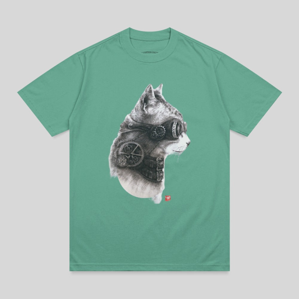 Steampunk cat wearing goggles and gears on a green t-shirt.