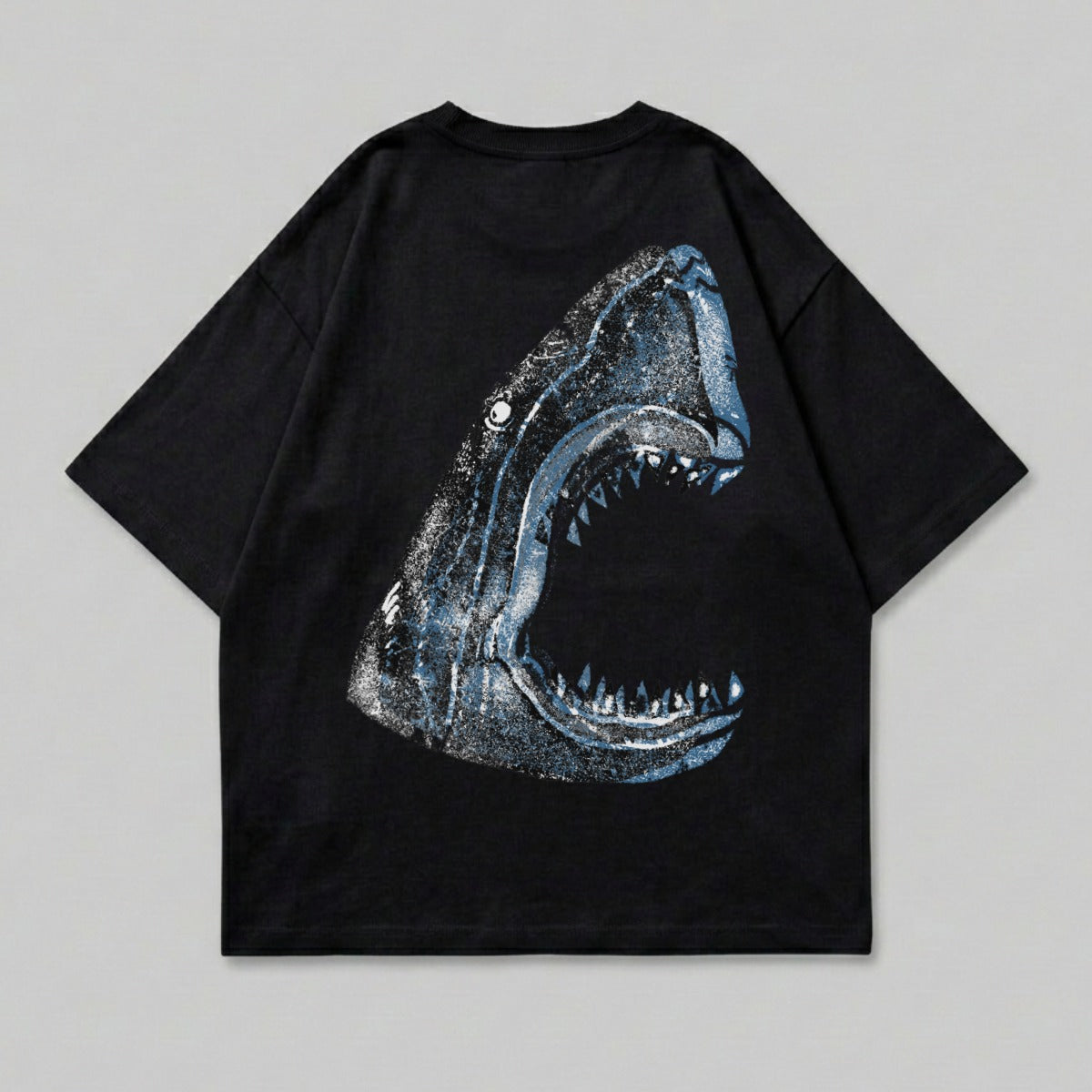 Black t-shirt with a distressed blue shark mouth graphic on the back.