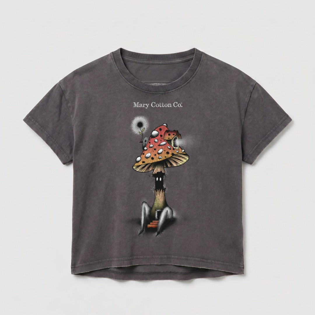 Dark t-shirt with a whimsical mushroom character illustration and "Mary Cotton Co." text.