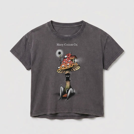 Dark t-shirt with a whimsical mushroom character illustration and "Mary Cotton Co." text.
