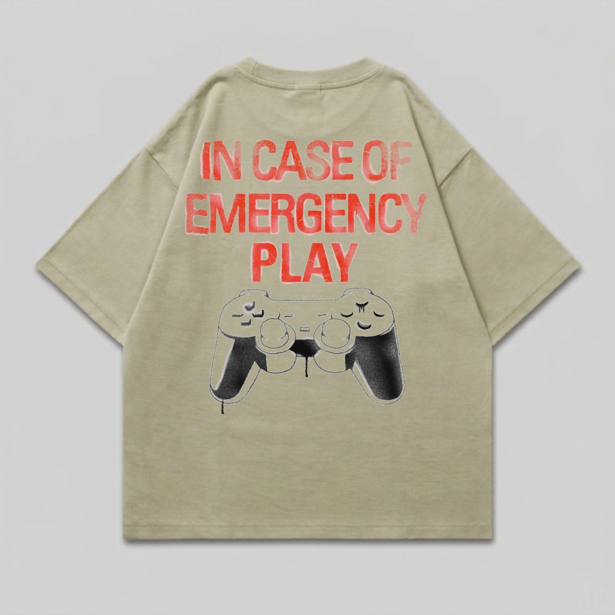 Tan t-shirt with "IN CASE OF EMERGENCY PLAY" and a controller graphic.