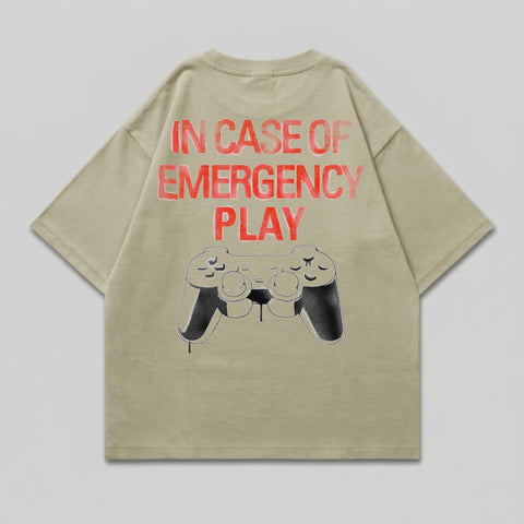 Tan t-shirt with "IN CASE OF EMERGENCY PLAY" and a controller graphic.
