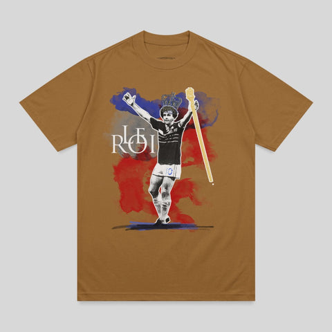T-shirt with illustration of crowned man with outstretched arms and "ROI" text.