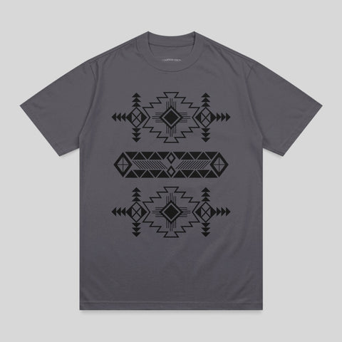 Gray t-shirt with black geometric Aztec-inspired pattern across the chest.