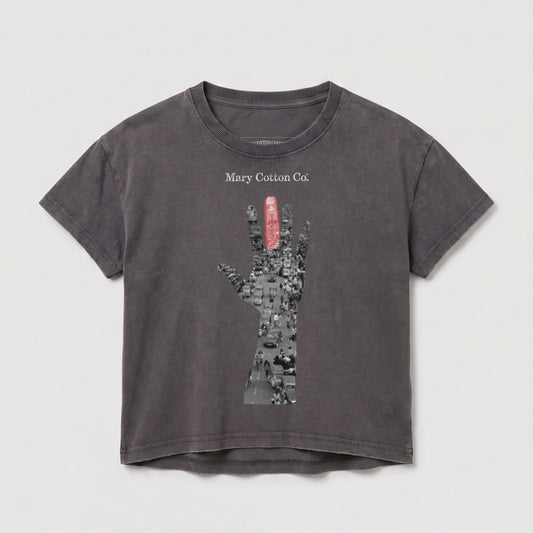 Gray t-shirt with "Mary Cotton Co." and a hand holding a red object over a city street.
