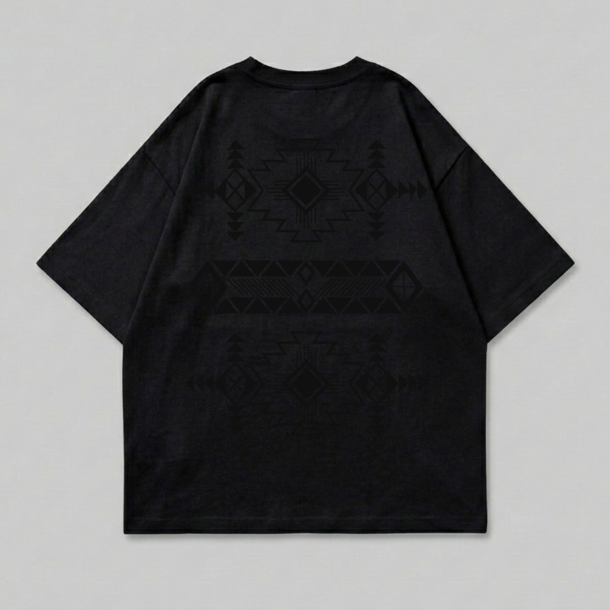 Black t-shirt with a geometric pattern on the back.