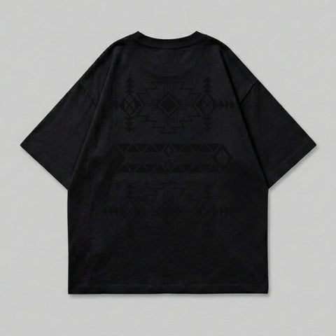 Black t-shirt with a geometric pattern on the back.