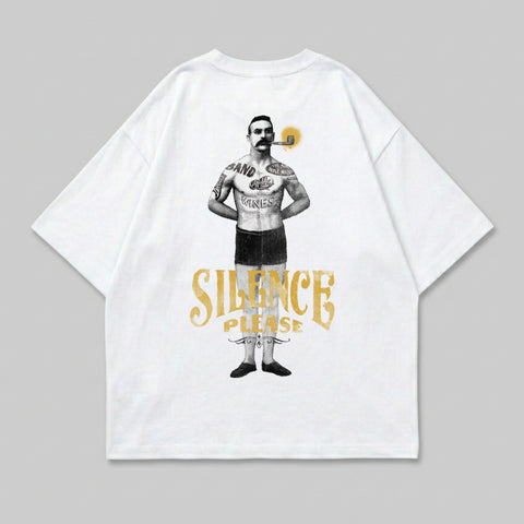 White t-shirt featuring a tattooed man smoking a pipe and "SILENCE PLEASE" text.