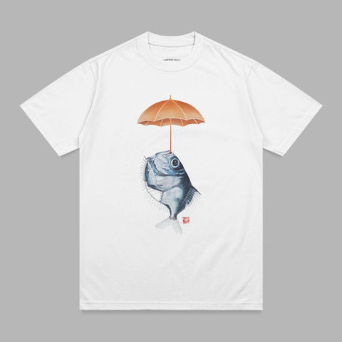 White t-shirt with illustration of a blue fish holding an orange umbrella.