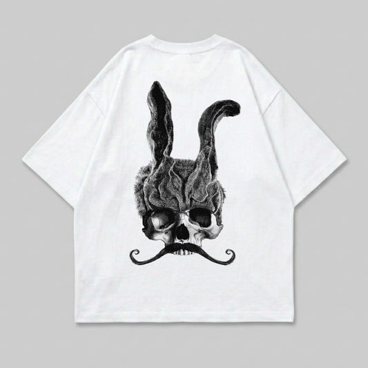 White t-shirt featuring a skull with rabbit ears and a mustache.