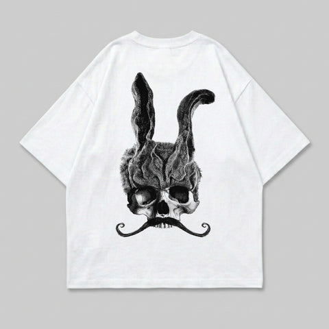 White t-shirt featuring a skull with rabbit ears and a mustache.