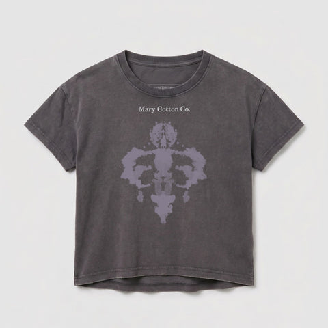 Grey cropped t-shirt with a Rorschach-style ink blot design and "Mary Cotton Co." text.