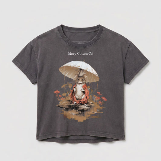 Mouse in raincoat holding umbrella with "Mary Cotton Co." text.
