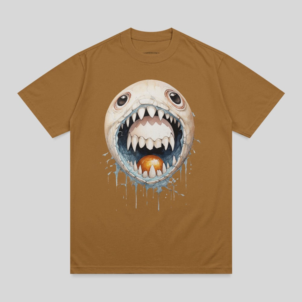 Brown t-shirt with a cartoonish monster with wide eyes and a gaping mouth.