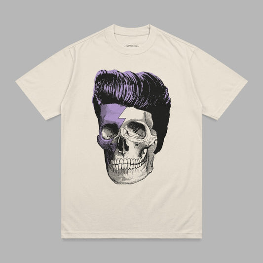 T-shirt with a cream color and a vintage skull with purple hair and a lightning bolt.