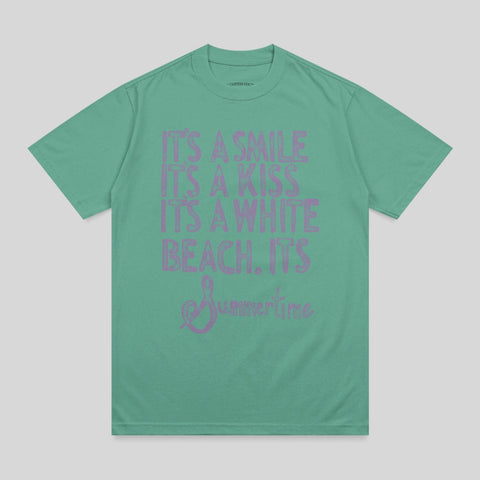 Green t-shirt with pink text reading "IT'S A SMILE, IT'S A KISS, IT'S A WHITE BEACH, IT'S Summertime."